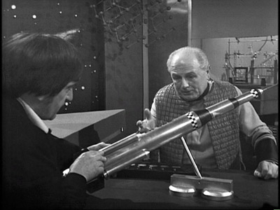 The Doctor discusses retro rockets with Professor Eldred