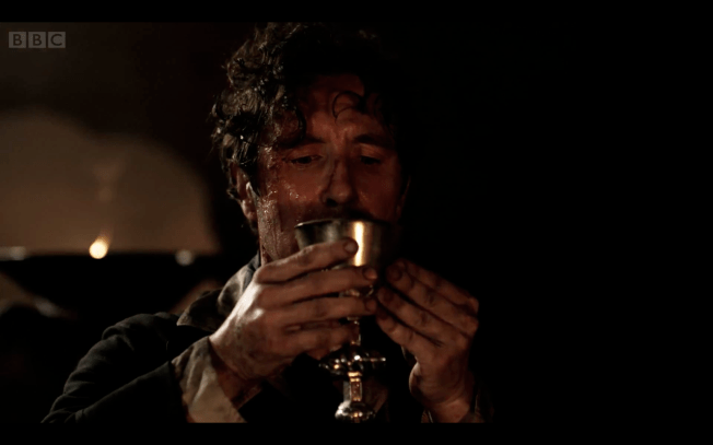 Having chosen his fate, the Eighth Doctor drinks the potion provided to him by the Sisters of Karn
